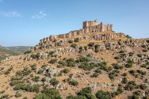 The hilltop castle fortress and former convent of Calatrava La Nueva, in Aldea Real, Ciudad Real province Castilla La Mancha Spain, Low Front Aerial View