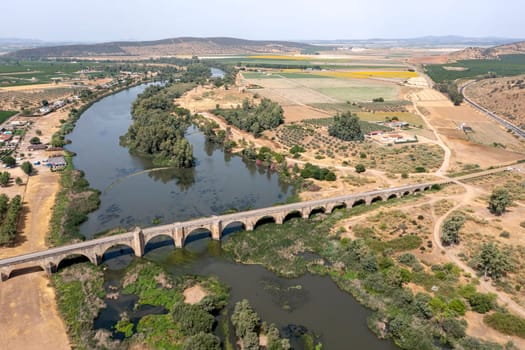 Aerial view of the Roman bridge over the Guadiana river in Medellin, a Spanish municipality in the province of Badajoz, in the autonomous community of Extremadura. Spain