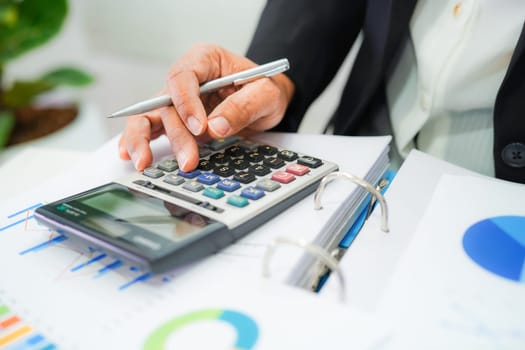 Businessman working and analysis with statistic graph in office.