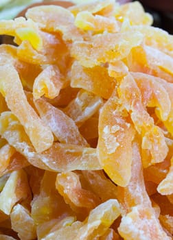 Bowl with dried melon fruit. Slices displayed at street market stall