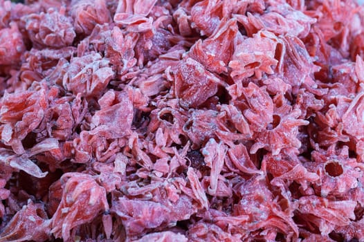 Dried hibiscus flowers. Slices displayed at street market stall