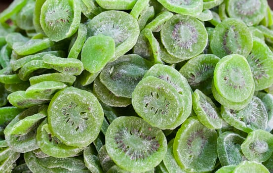 Bowl with dried kiwifruit. Slices displayed at street market stall