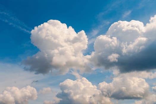 White, Fluffy Clouds In Blue Sky. Background From Clouds.