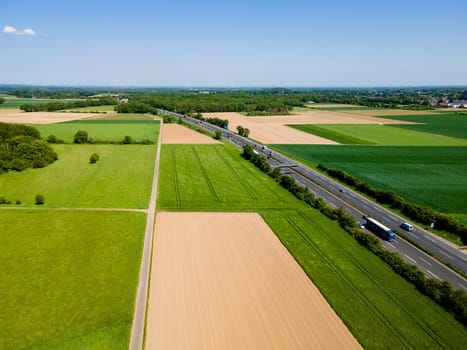 Farmland from above. Aerial view over green fields