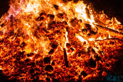 Burning coals from a fire abstract background.