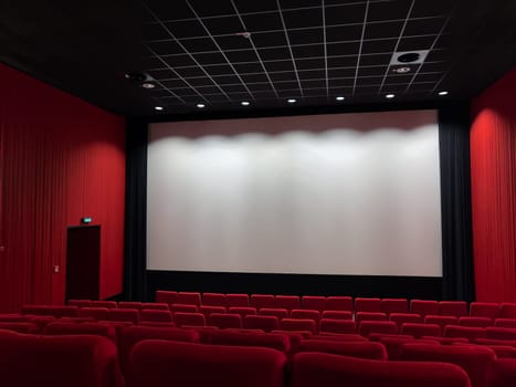 Cinema Screen  And Red Seats. Empty Screening Theater