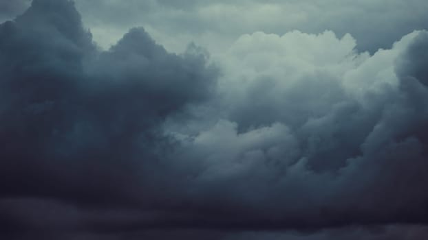 Storm sky with dark grey cumulus clouds.  Thunderstorm