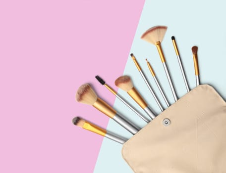 Cosmetics. Make up brushes set. Coloured background with clipping path