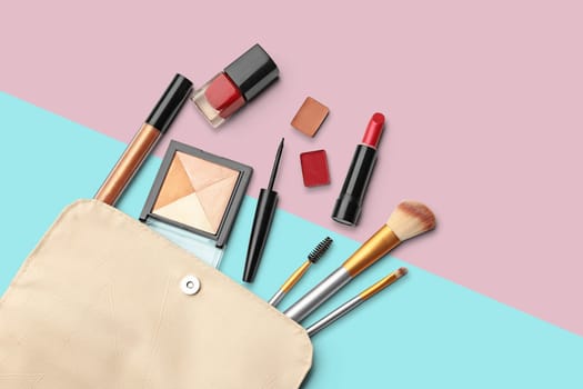 Make up products. Lipstick, powder, shadows with cosmetic bag. Image with copy space. Colored background with clipping path