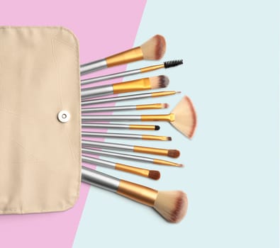 Cosmetics. Make up brushes set. Coloured background with clipping path