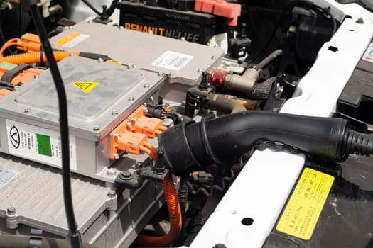 MINSK, BELARUS - 18 JUIN 2022 - an electrocar with a charging cord, connecting it to a charger, electric vehicle service for renault close up