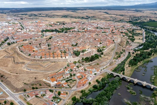 Panoramic aerial view of Ciudad Rodrigo in the province of Salamanca Spain, view of the Roman bridge over the Agueda river, view from the west