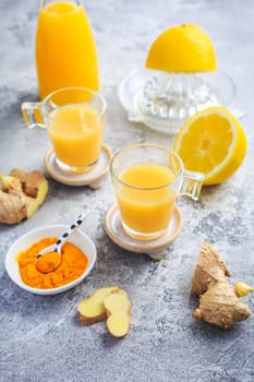 Close up of healthy Ginger Lemon Turmeric Shot – ideal to boost the immune system