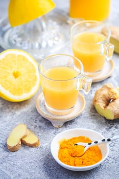 Close up of healthy Ginger Lemon Turmeric Shot – ideal to boost the immune system