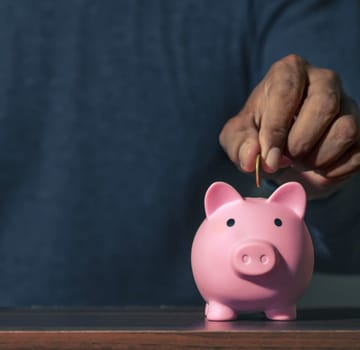 Save money and account banking for finance concept, Piggy bank with coin on blurred background, Save Monney for Investors Using Internet to Trade Stocks or Trade Fund