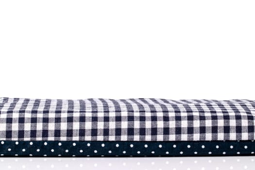Closeup of a cherry pit filled pillow for pain and tension on a table isolated on white background. Copy space for your product presentation montage. Macro.
