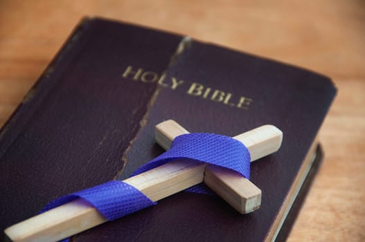 Holy cross on top of Holy bible. Religion concept.