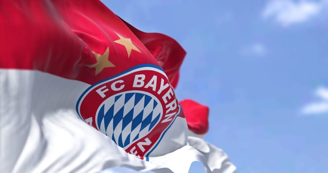 Munich, GER, May 2022: The Bayern Munich Flag waving in the wind from behind. Bayern Munich is a German sports club based in Munich
