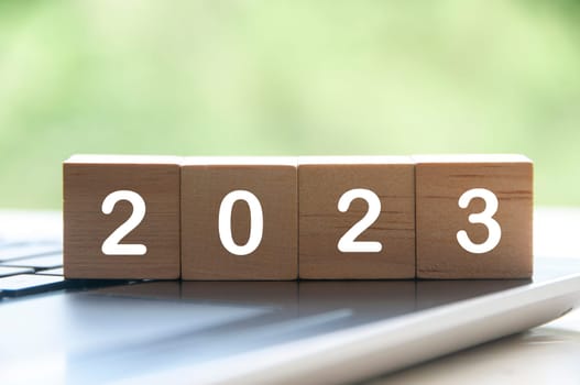 New year 2023 on wooden blocks on a laptop - New year concept