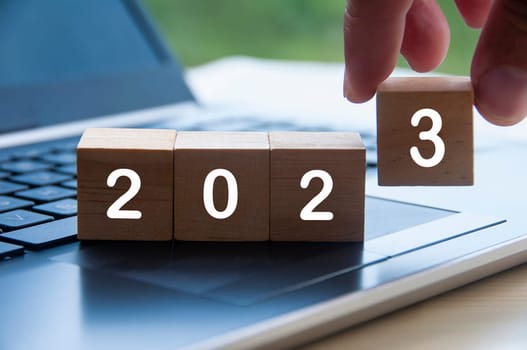 New year 2023 on wooden blocks on a laptop - New year concept
