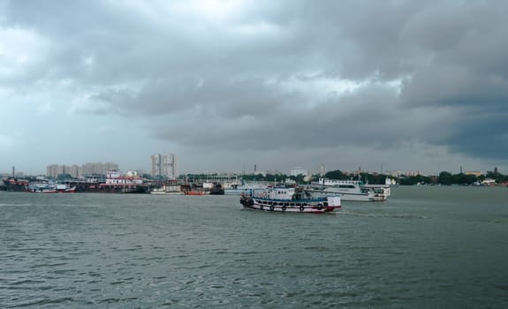 Beautiful Landscape View of Dramatic clouds over Ganges River horizon on a Dark cloudy day. View from Babu Ghat. Kolkata West Bengal India South Asia 19 June 2022