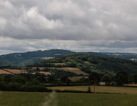 Panoramic farmland landscape with field and tree in Aveyron france