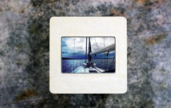 Sailing boat on slide film