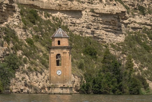 Tower of the Church of San Juan Evangelista in the Ribarroja reservoir, Aragon, Spain