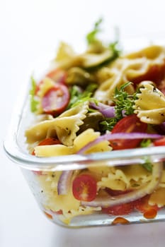 close up of a tray of pasta salad