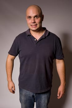Portrait of young silly man on a dark background