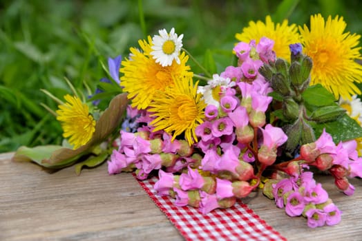 Spring flowers on a wooden board