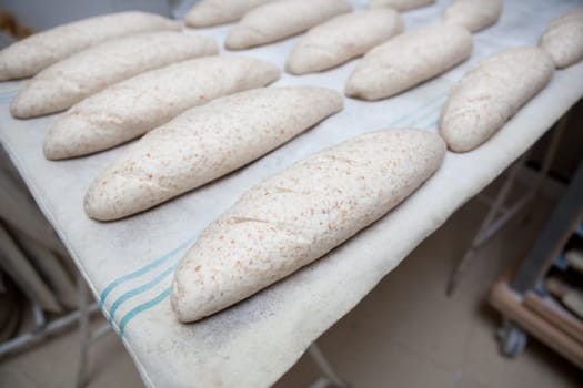 Wholemeal bread dough before putting it into the oven. Manufacturing process of spanish bread