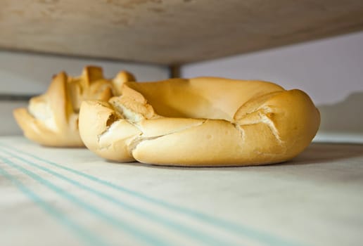 Doughnut fresh baked bread. Manufacturing process of spanish bread