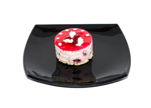 on a plate, cake with cream in the form of mushrooms