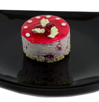 cream cake in the form of a mushroom on a plate, close up