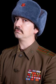 young man dressed as russian military, studio