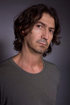 young casual man portrait in a dark background
