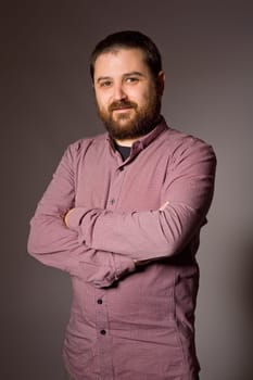 young casual man portrait in a dark background