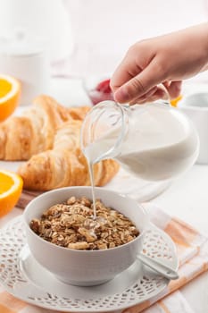Breakfast with cereal, milk, orange juice