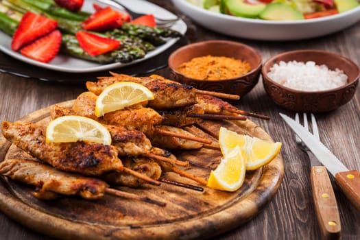 Grilled chicken skewers with lemon marinade and spices