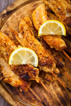 Grilled chicken skewers with lemon marinade
