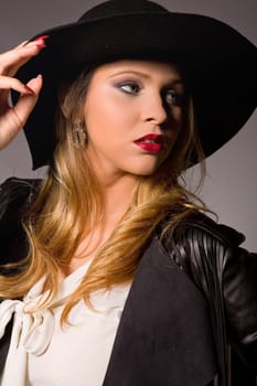fashion young woman on a grey background