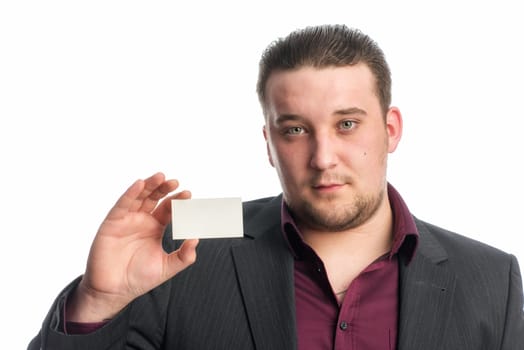 Man in suit holds a business card