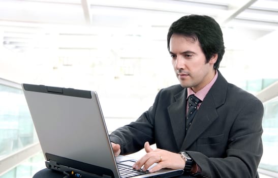 young man and working with is laptop