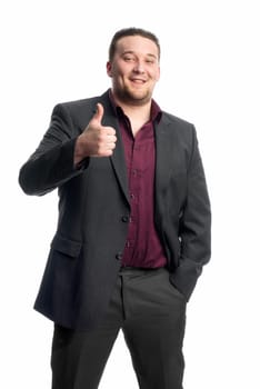 Young man in suit shows thumbs up