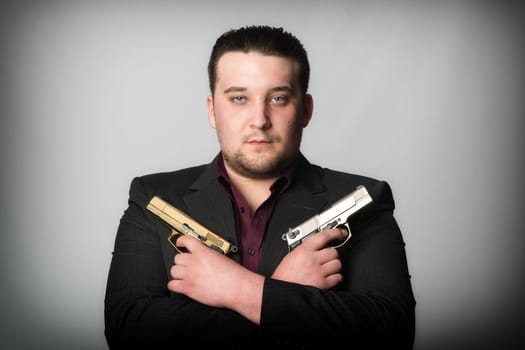 Agent holds two weapons