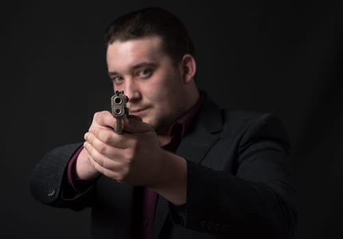 Young man targets with a gun