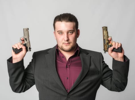 Young man with two pistols