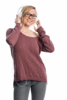 Young woman with glasses wearing headphones