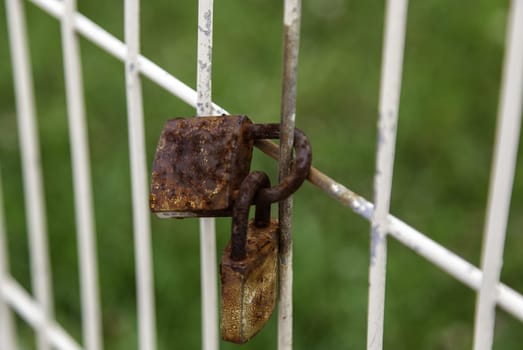 Detail of rusty and abandoned security locks, security